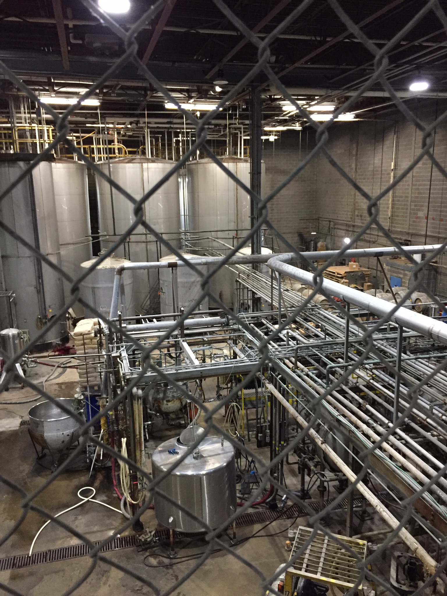 Industrial production brewery floor with stainless vessels